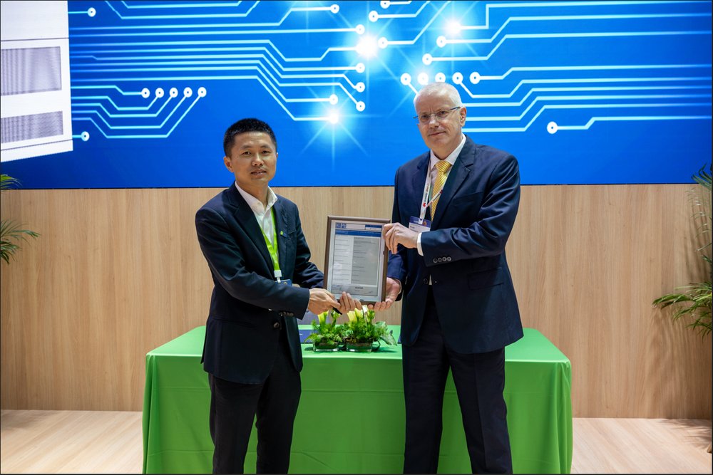 Two men in suits holding a piece of paperAI-generated content may be incorrect.