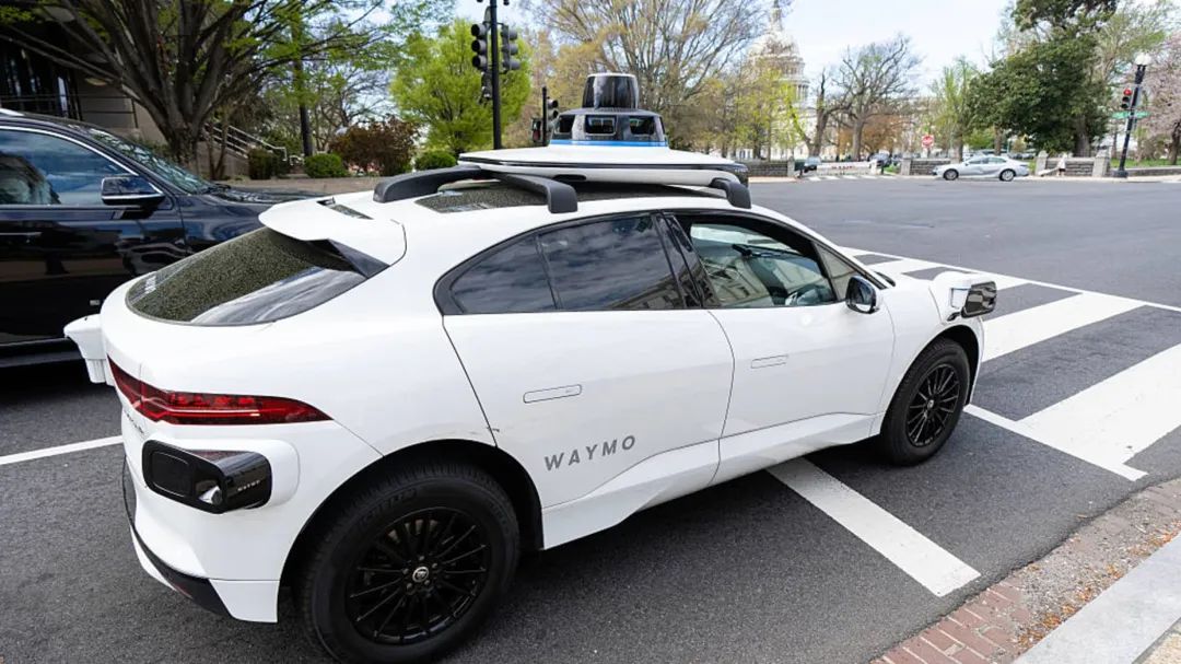 UNITED STATES - MARCH 31: A Waymo self-driving car,  seen here with a driver, stops at a red light outside the U.S. Capitol in Washington, D.C., on Friday, March 31, 2025. Waymo expects the ride-hailing service to launch in D.C. in 2026. (Bill Clark/CQ-Roll Call, Inc via Getty Images)